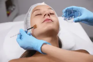 Woman receiving a chemical peel for dark spots in Ashburn, VA at Amy Aesthetics & Wellness®